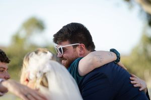 Outdoor wedding celebration with guests congratulating the bride and groom Buckland estate wedding