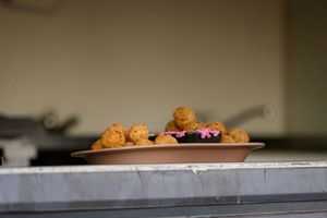 Close-up view of appetizers arranged on a serving platter at catering event.