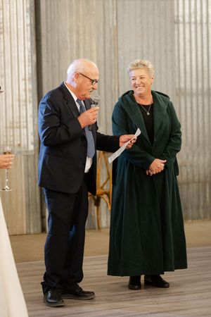 parents of the newley weds giving their speeches at the wedding reception