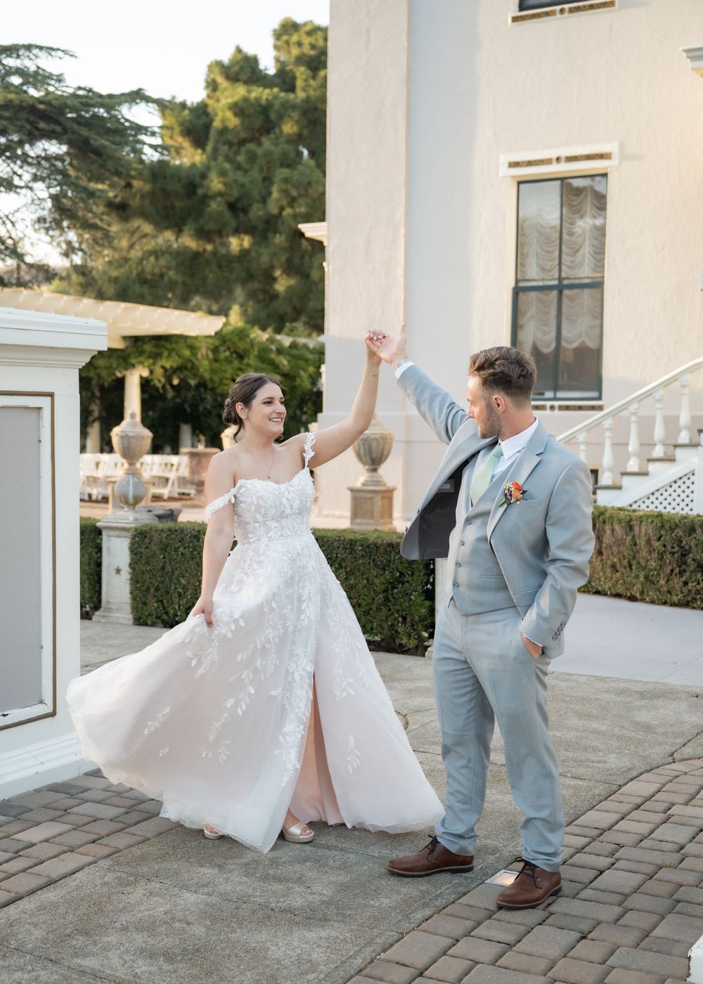 Bride and groom portraits outside Jefferson Street Mansion at golden hour