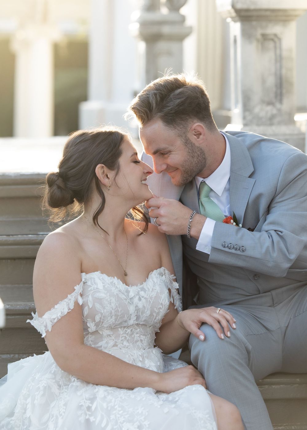 Couple enjoying sunset portraits in front of Jefferson Street Mansion