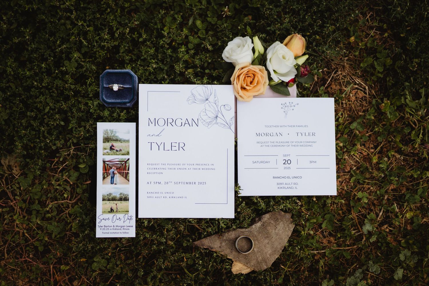 Wedding invitation suite with elegant calligraphy and floral details laid out on rustic natural surfaces.