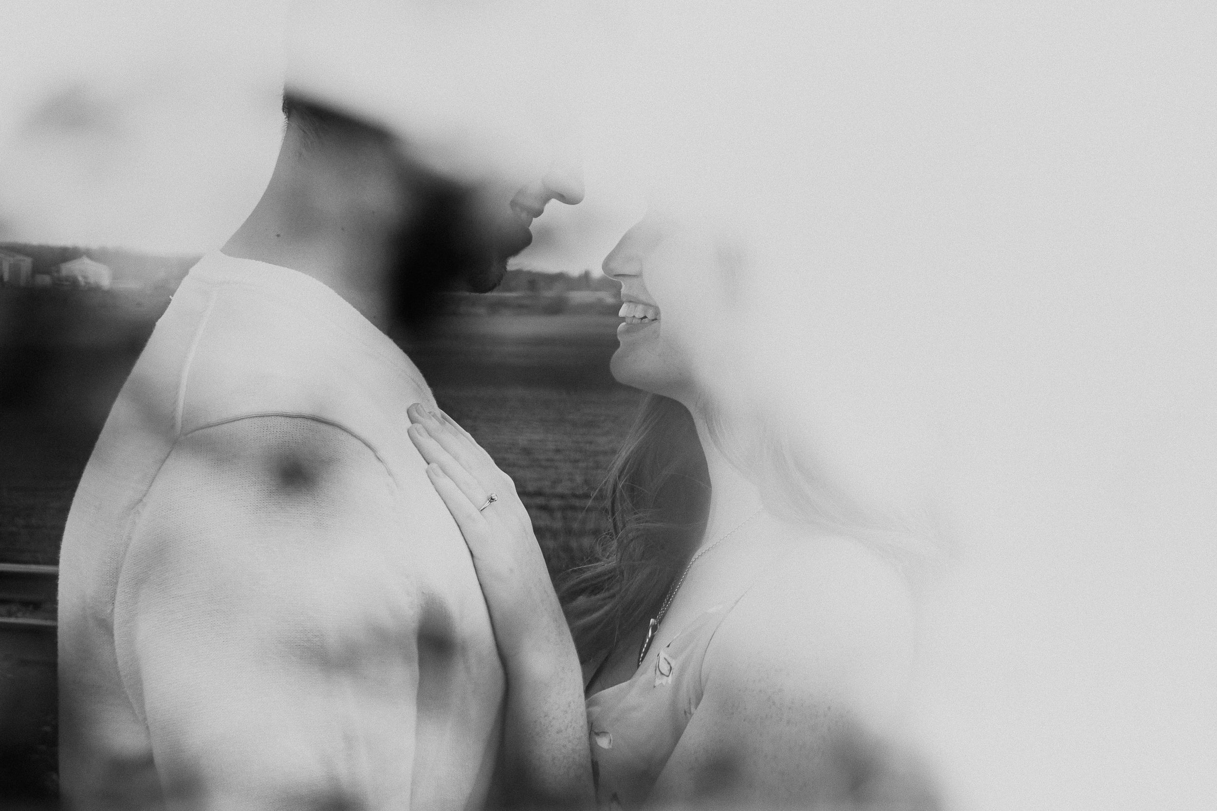 Abstract black and white artistic double exposure portrait with blurred edges.