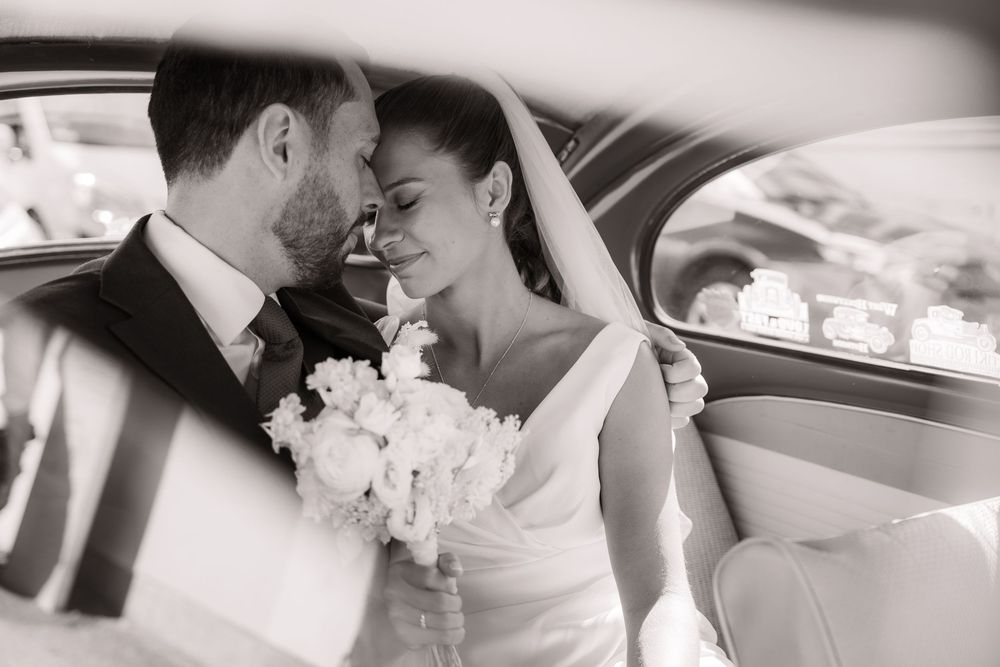 Black and white wedding photo collage capturing intimate moments between newlyweds in candid poses.