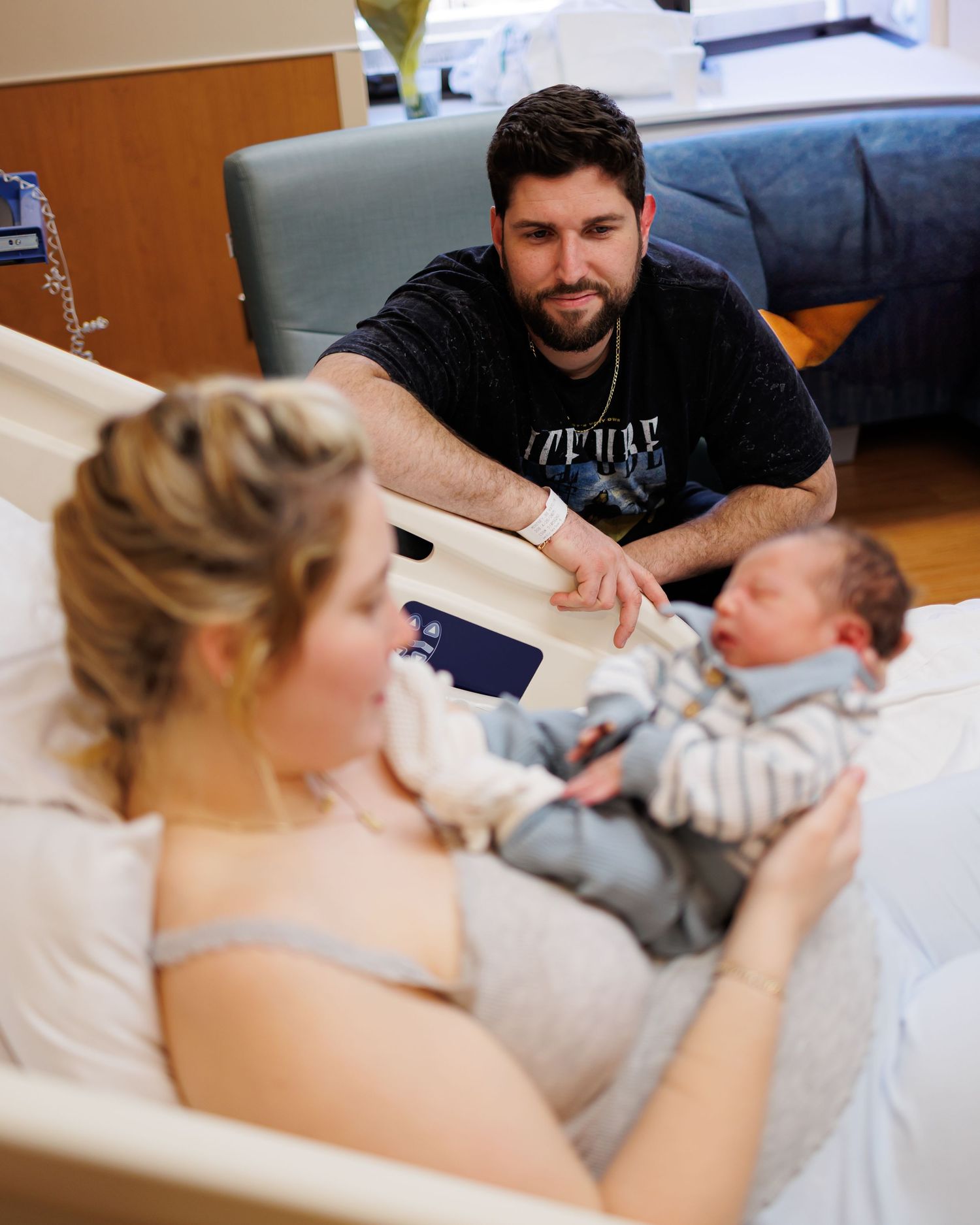 A series of connected photos showing tender moments as a new baby is welcomed into this world.