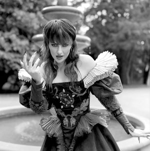 Black and white photograph showing Jessica Wilcock wearing an Edwardian styled gown made by Dani Valentine of @valentinecostumery