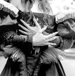 Black and white photograph showing Jessica Wilcock wearing an Edwardian styled gown made by Dani Valentine of @valentinecostumery