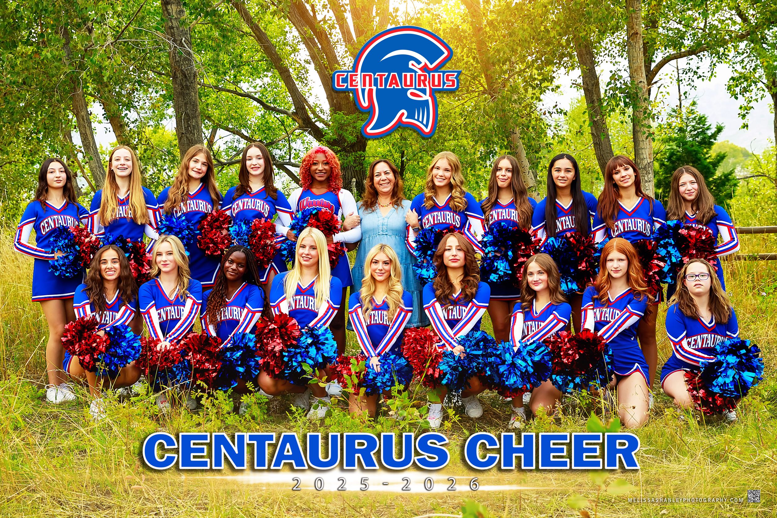 Group of blue and red cheerleaders pose outdoors in uniforms during a sunny field photoshoot session.
