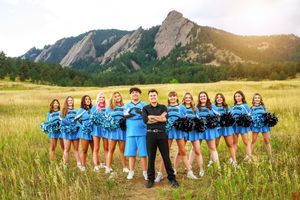 A panoramic collage showing a group posed in various arrangements against a scenic mountain backdrop and grasslands.