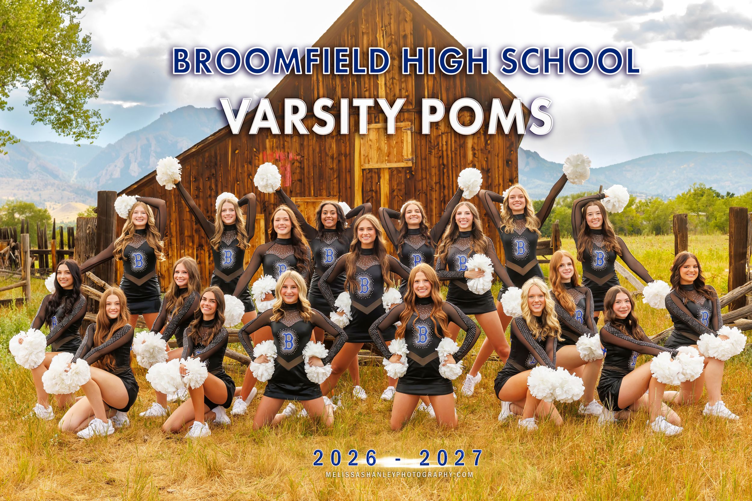 Broomfield High School Varsity Poms team photo 2026-2027, girls in uniform posing outdoors near rustic barn.