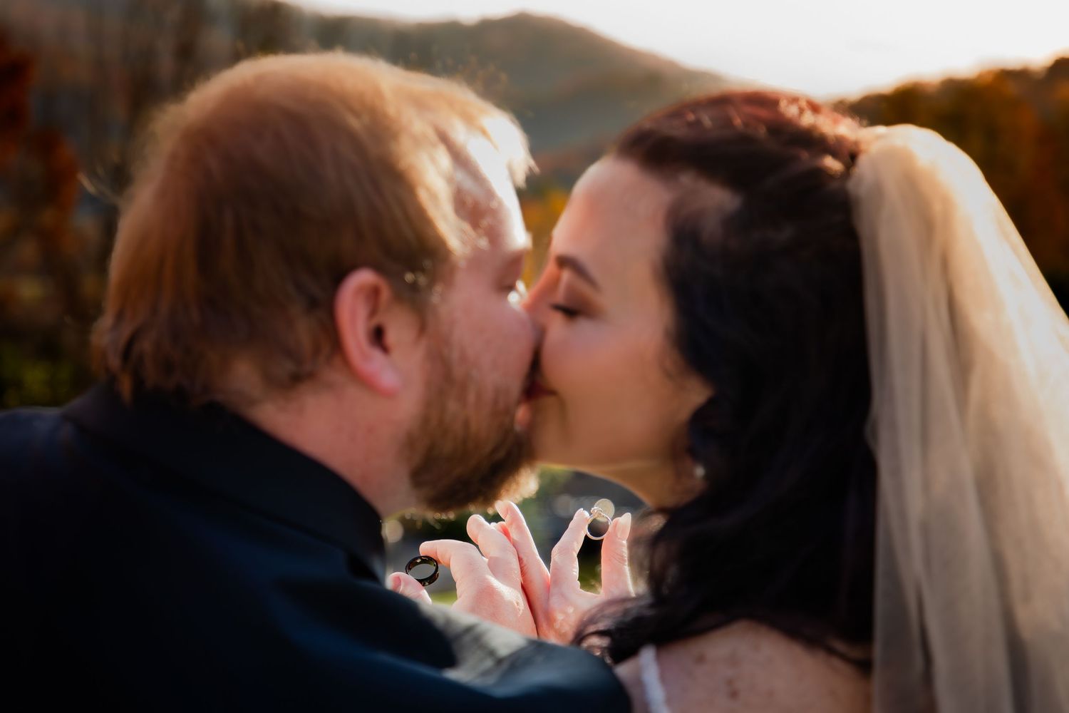 A sequence of wedding photos showing a couple sharing romantic kisses at different moments during their celebration.