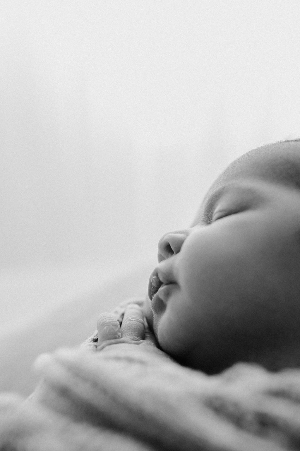 Lauren Lunn Photography captures serene newborn baby details in black and white during Adelaide studio session.