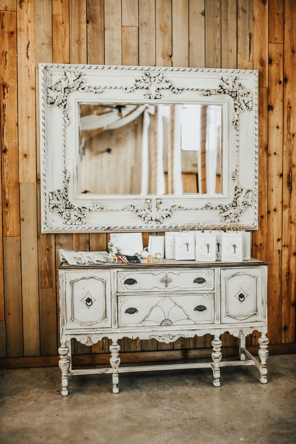 Bride’s wedding decor inside Whispering Oaks modern rustic barn