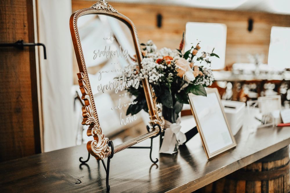 Rustic chic wedding decor inside Whispering Oaks barn
