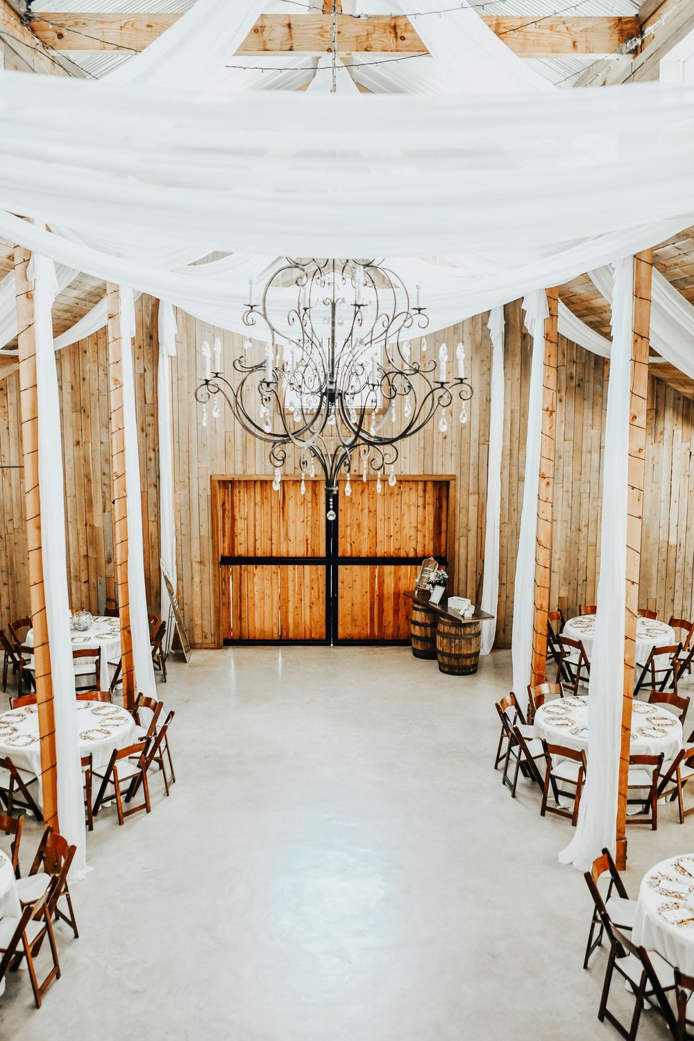 Whispering Oaks modern barn interior decorated for wedding captured by April Pinto Photography in Dallas-Fort Worth.