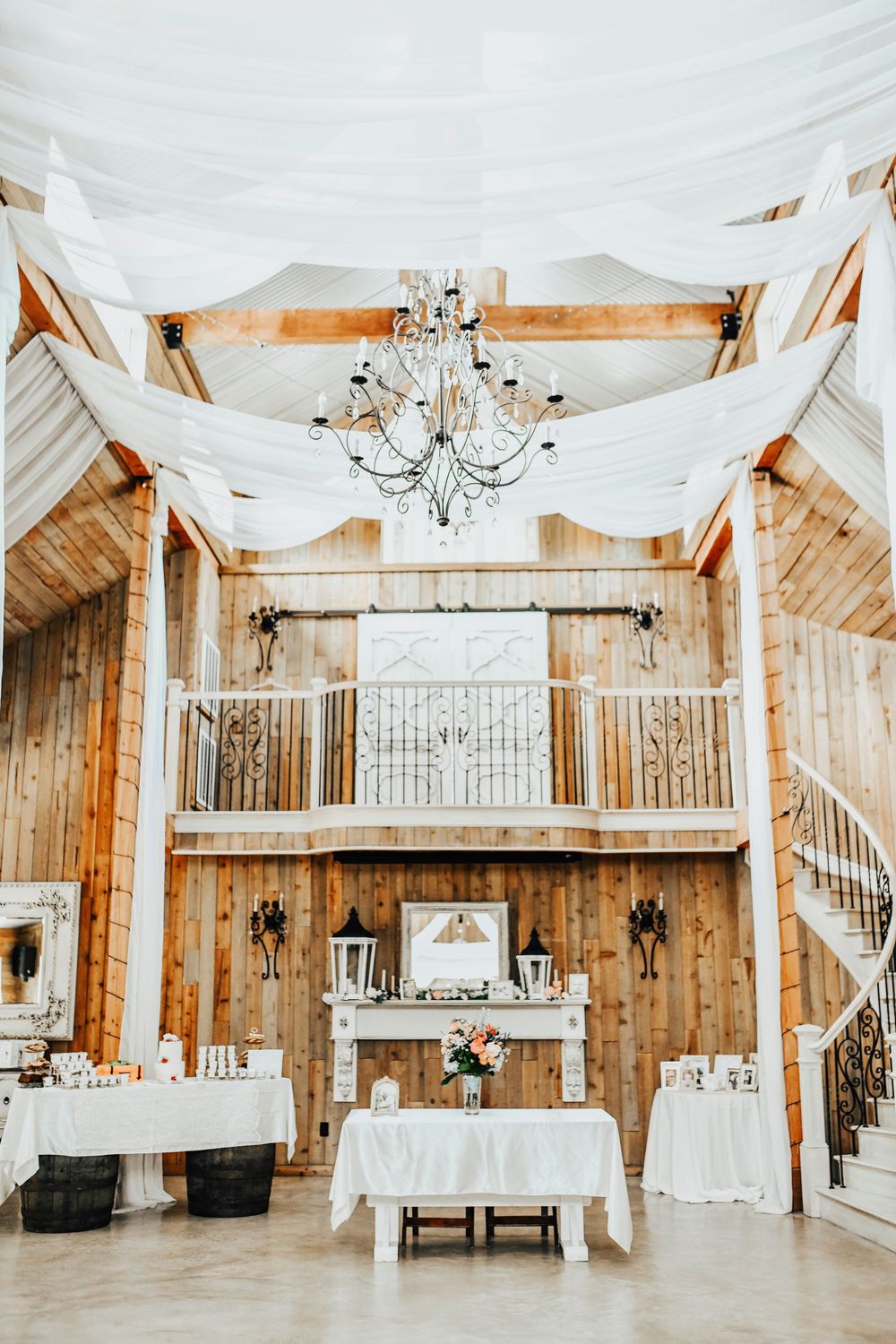 Wedding tables with floral centerpieces at Whispering Oaks