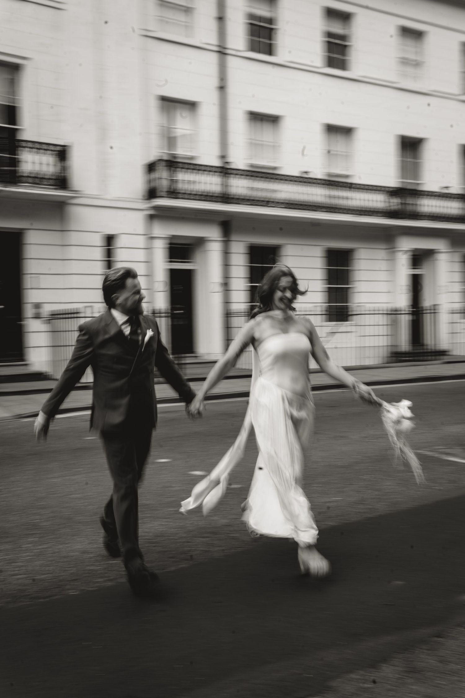 newlyweds running across the street in york