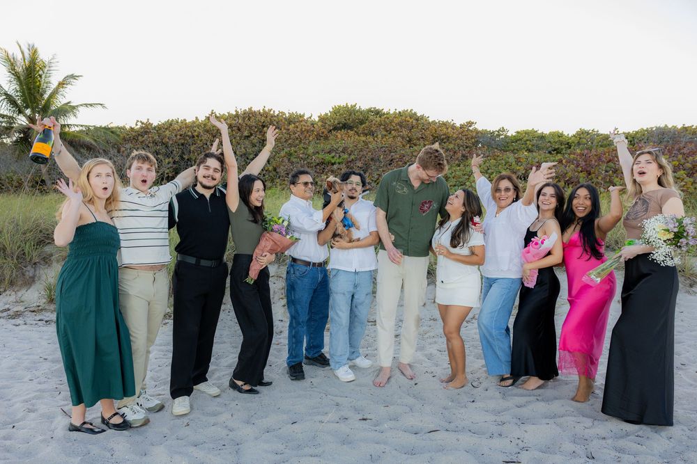 family and friends celebrating after engagement at Hollywood North beach park
