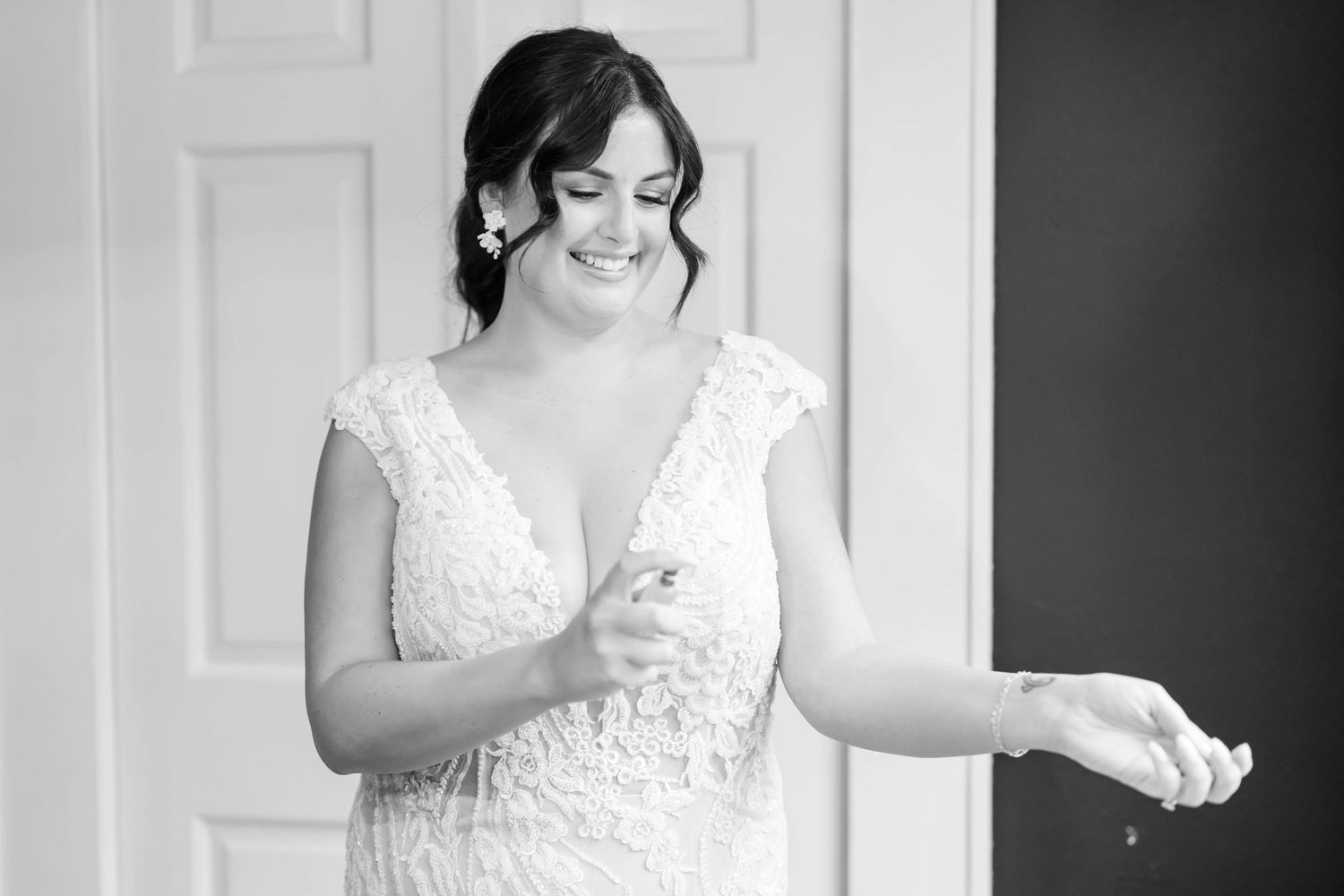 bride spraying perfume