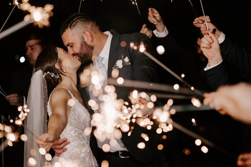 Sparklers create magical light trails during a nighttime celebration.