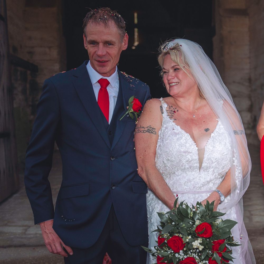 A wedding couple poses together in a series of five photos showing them smiling and embracing at their ceremony.