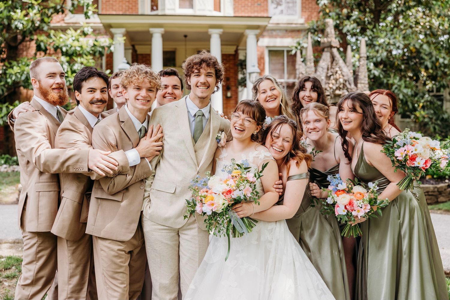 Happy, joyful, loving bridal party photo. Group hug at The Inn at Oneonta in Northern Kentucky.