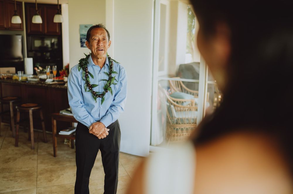 Heartfelt moment captured during pre-wedding preparations in natural light.