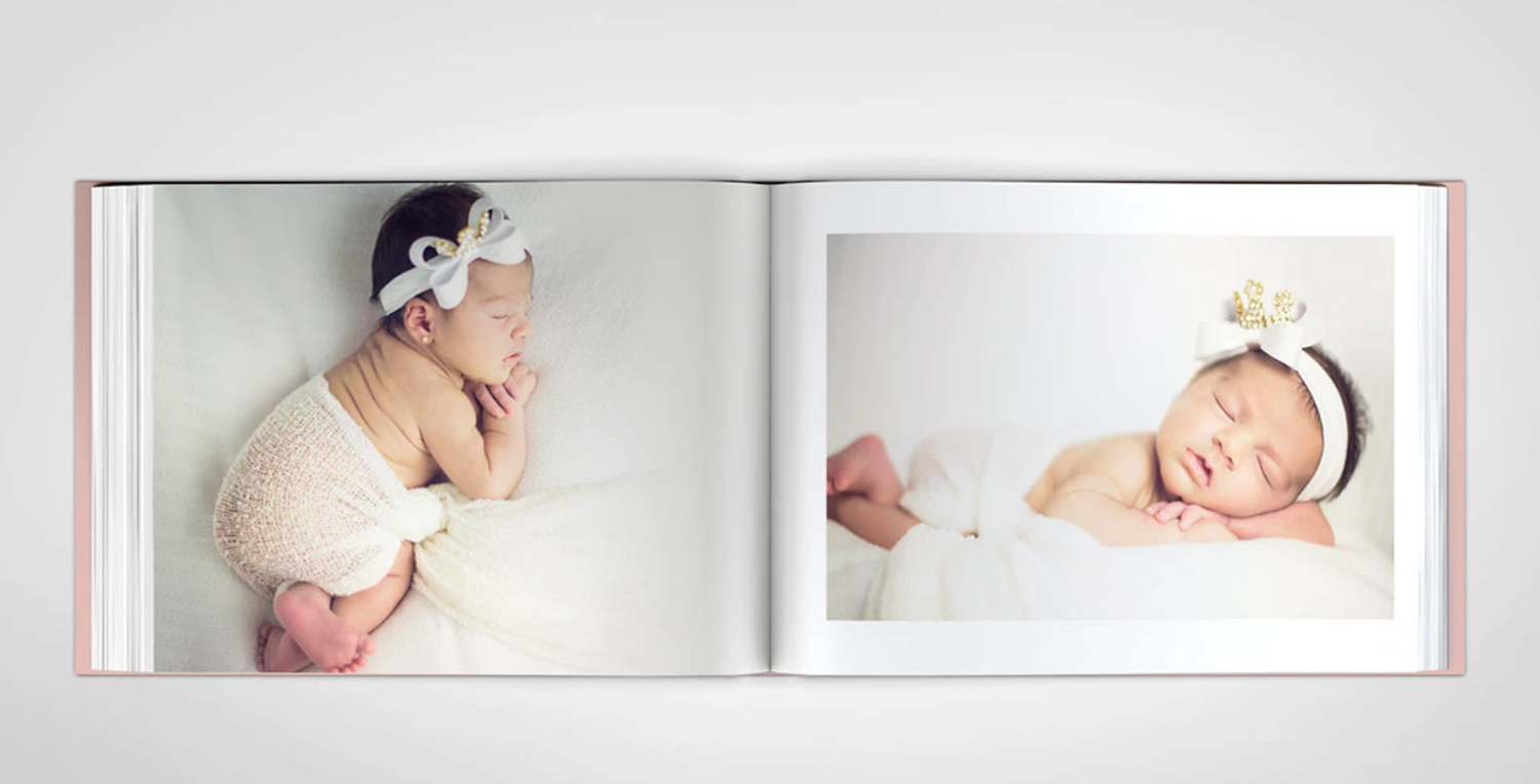 Collection of newborn photos displayed in white photo album layout.