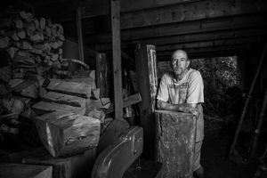A series of vintage black and white photographs showing workers in a factory or industrial setting.