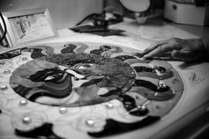 Close-up panoramic shot of vinyl records and audio equipment in monochrome.
