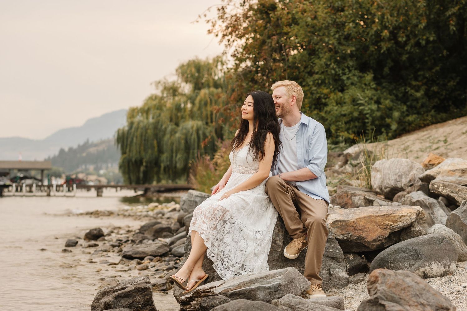 Engagement photos of a couple during golden sunset hour in West Kelowna, BC