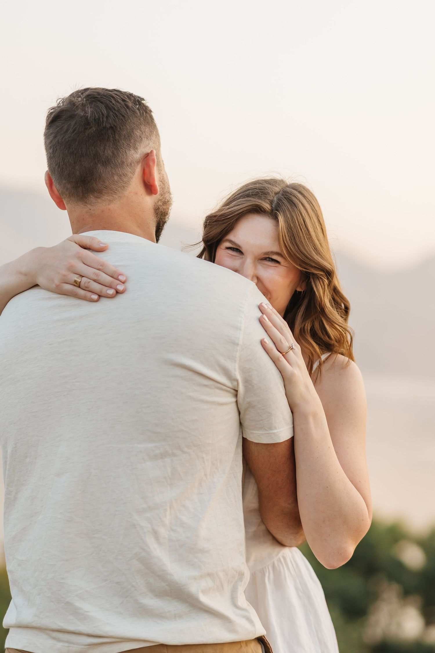 Engagement photos captured during a romantic photoshoot in soft evening light during sunset at Sanctuary Gardens in West Kelowna, bc.