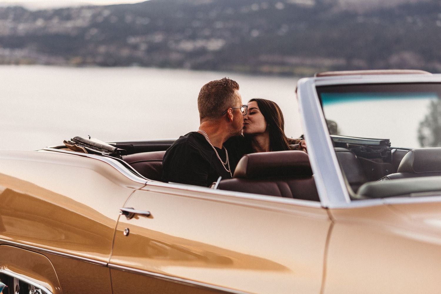 Vintage car parked at Knox mountain during a Kelowna engagement photo session