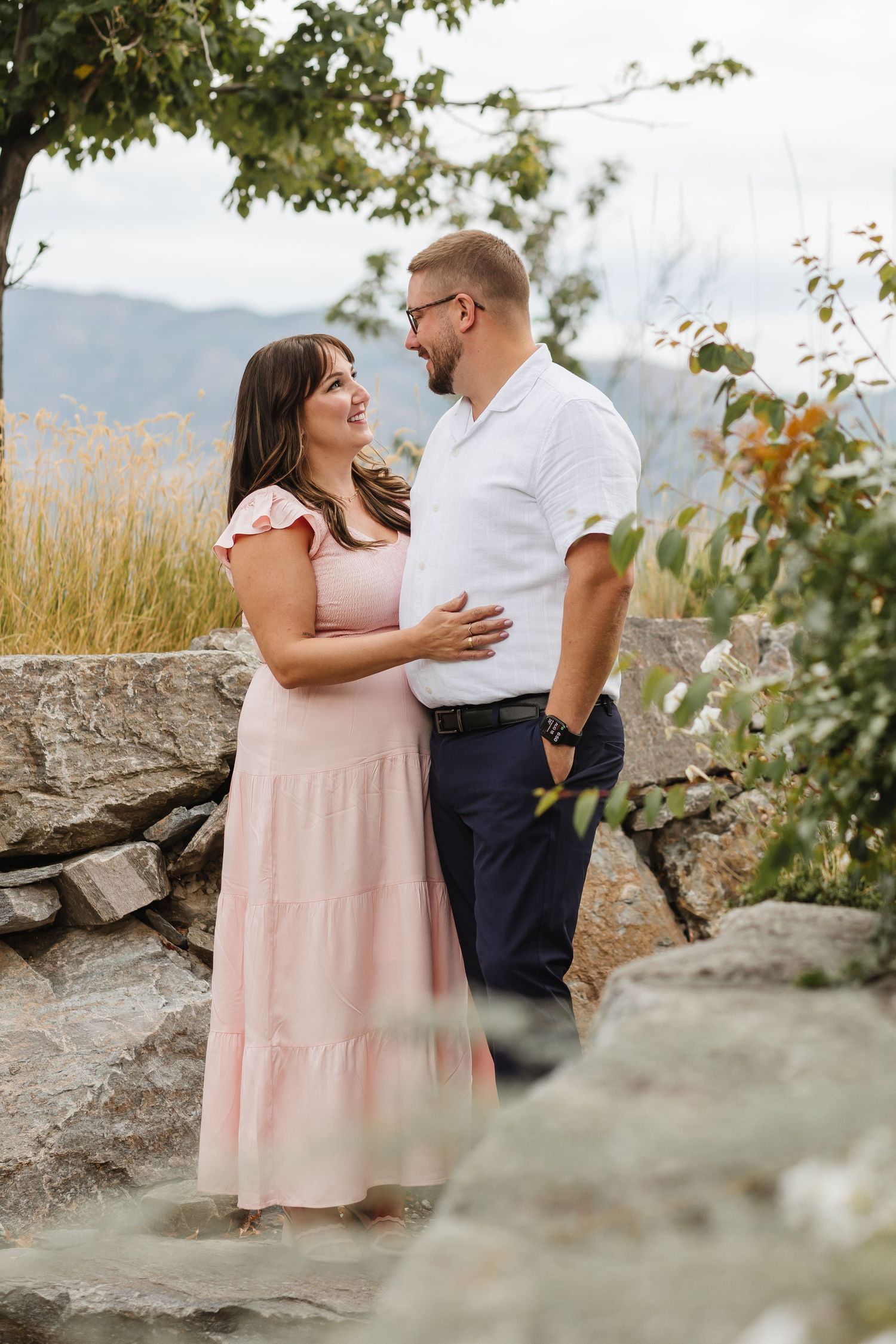 Couple's session for engagement photos taken in the garden at Sanctuary Gardens in West Kelowna, BC around a stone walkway