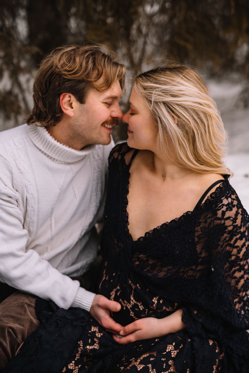 A romantic couple shares tender moments in a series of intimate photos, with one wearing white and the other in black lace.
