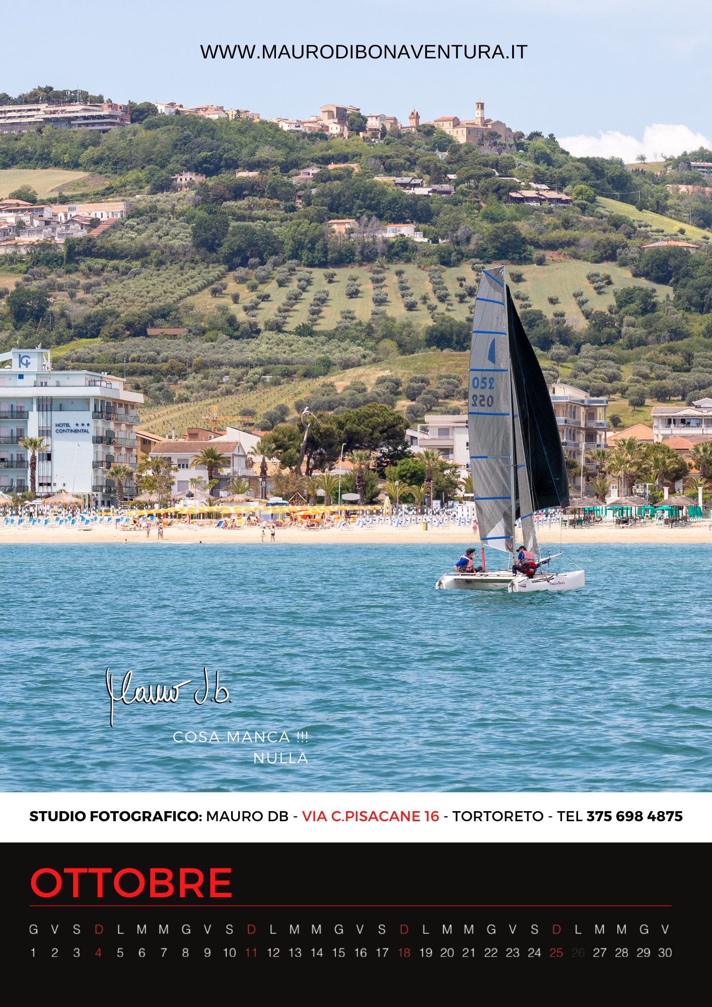 Sailboat glides across blue waters near coastal town with hillside buildings for October calendar.