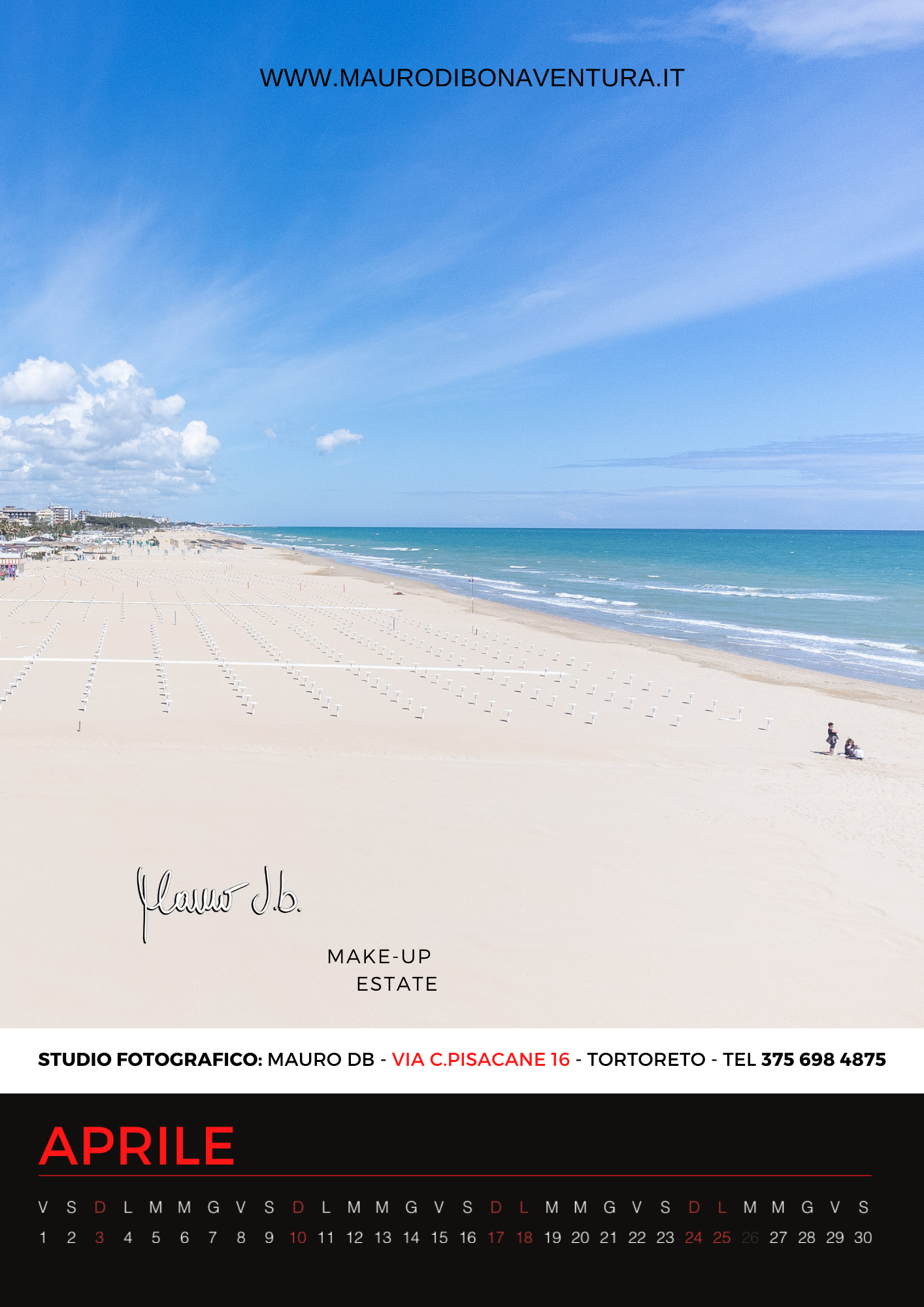 Pristine white sand beach stretching along turquoise waters under blue skies.