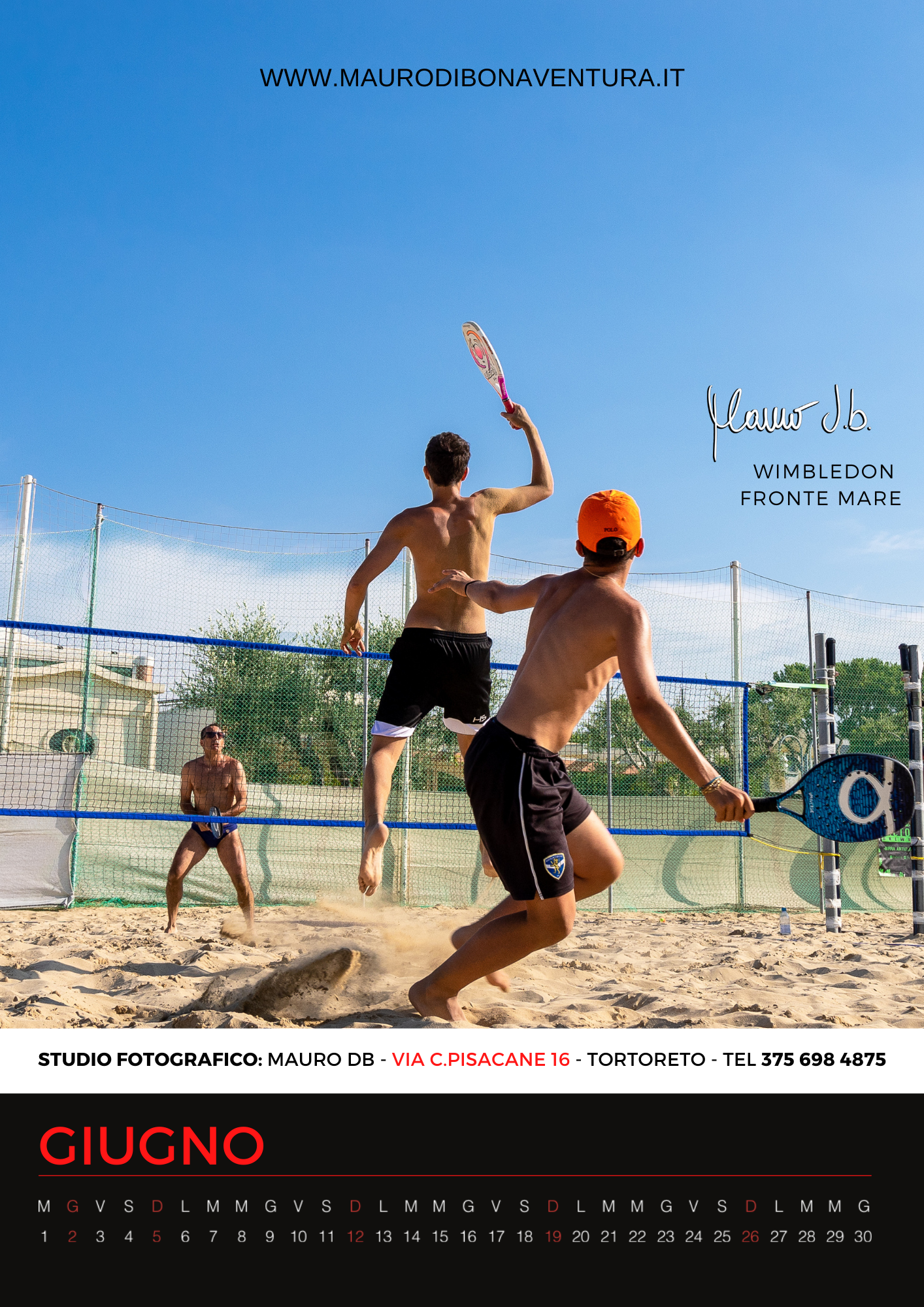 Athletes playing beach volleyball on a sandy court during a summer match.