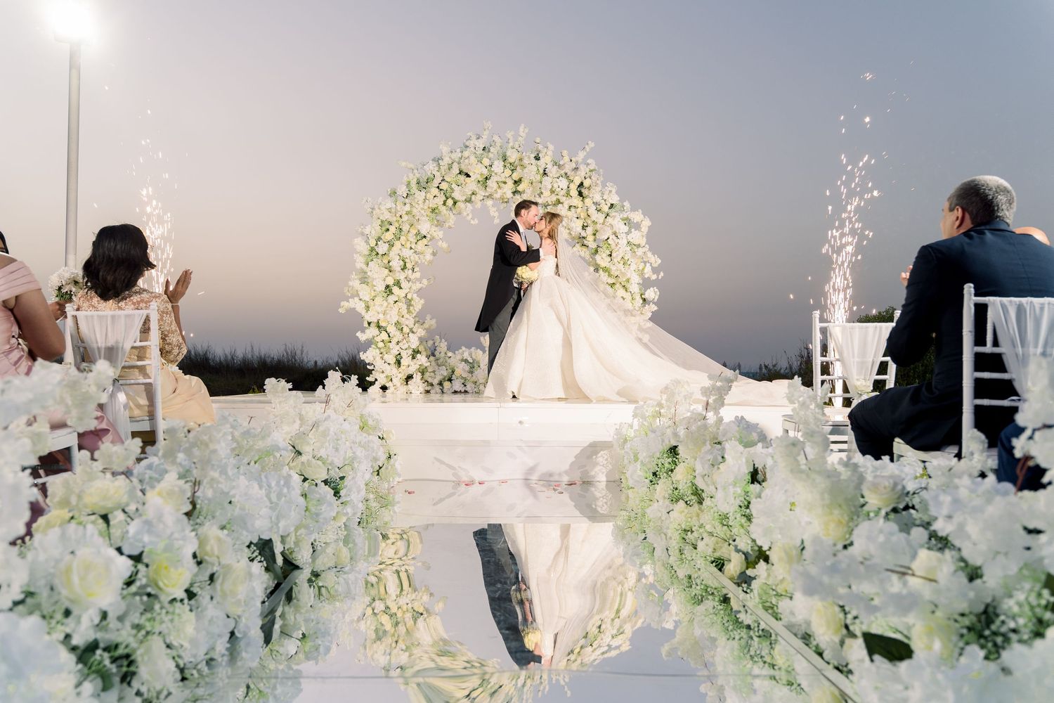 A silhouetted figure in backlit vapor stands behind frosted glass creating an ethereal atmospheric effect.