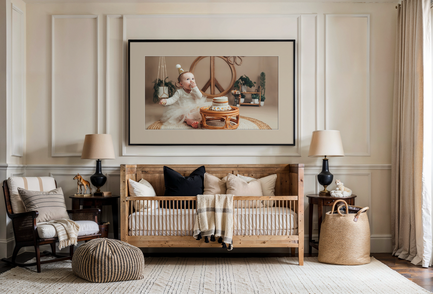 Elegant living room with blue built-in bookshelves, white sofa, round wood coffee table, and framed portrait above fireplace.