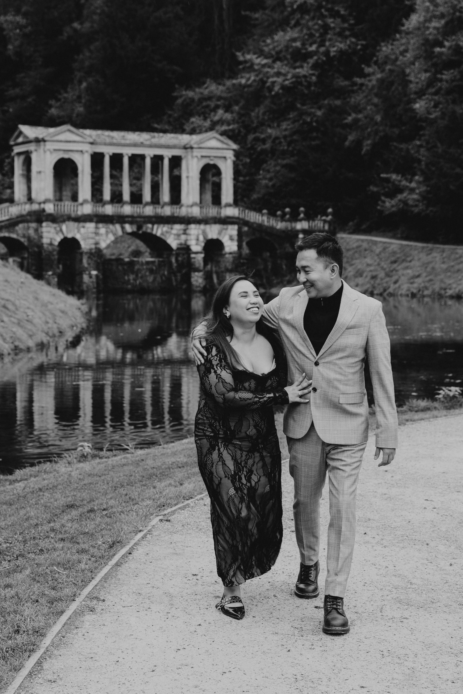 Couple walking near the Palladian Bridge at Prior Park Landscape Garden