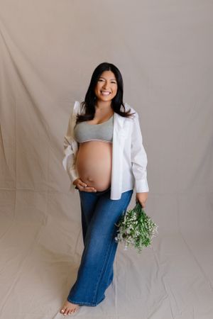 Expectant person in casual white shirt and jeans Studio Maternity Photographer in NJ | Sussex County NJ