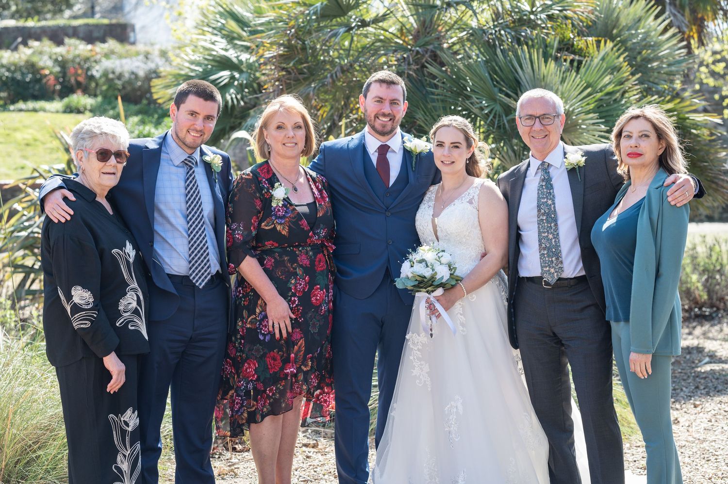 Group family wedding photo after ceremony in sunshine