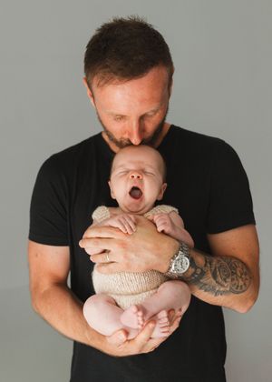 Father and son newborn baby photography, Newborn photography captured at home. Sarah Shaw Photography Stevenage Hertfordshire