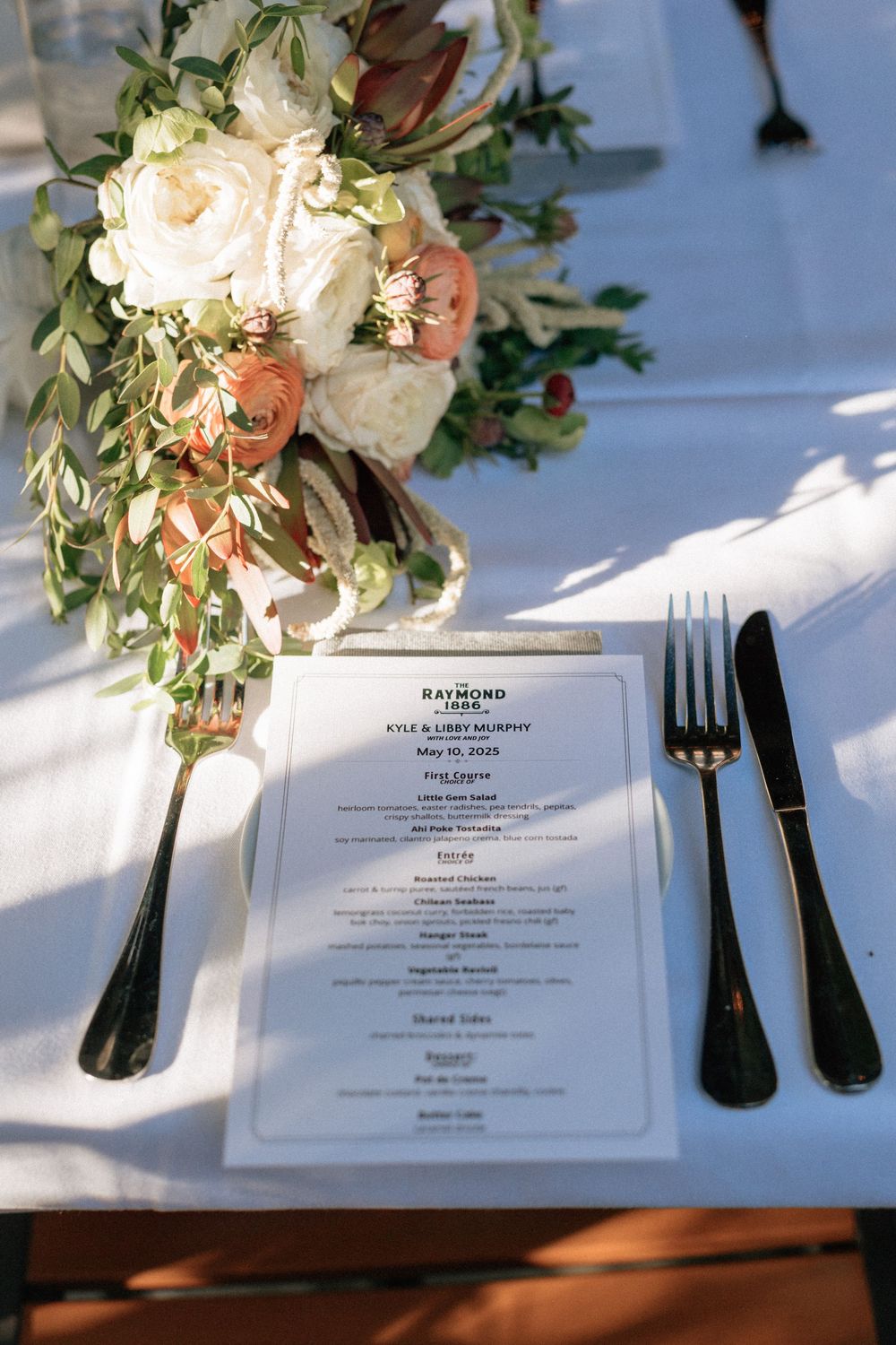 Vintage flatware and linen napkins at cozy restaurant reception.