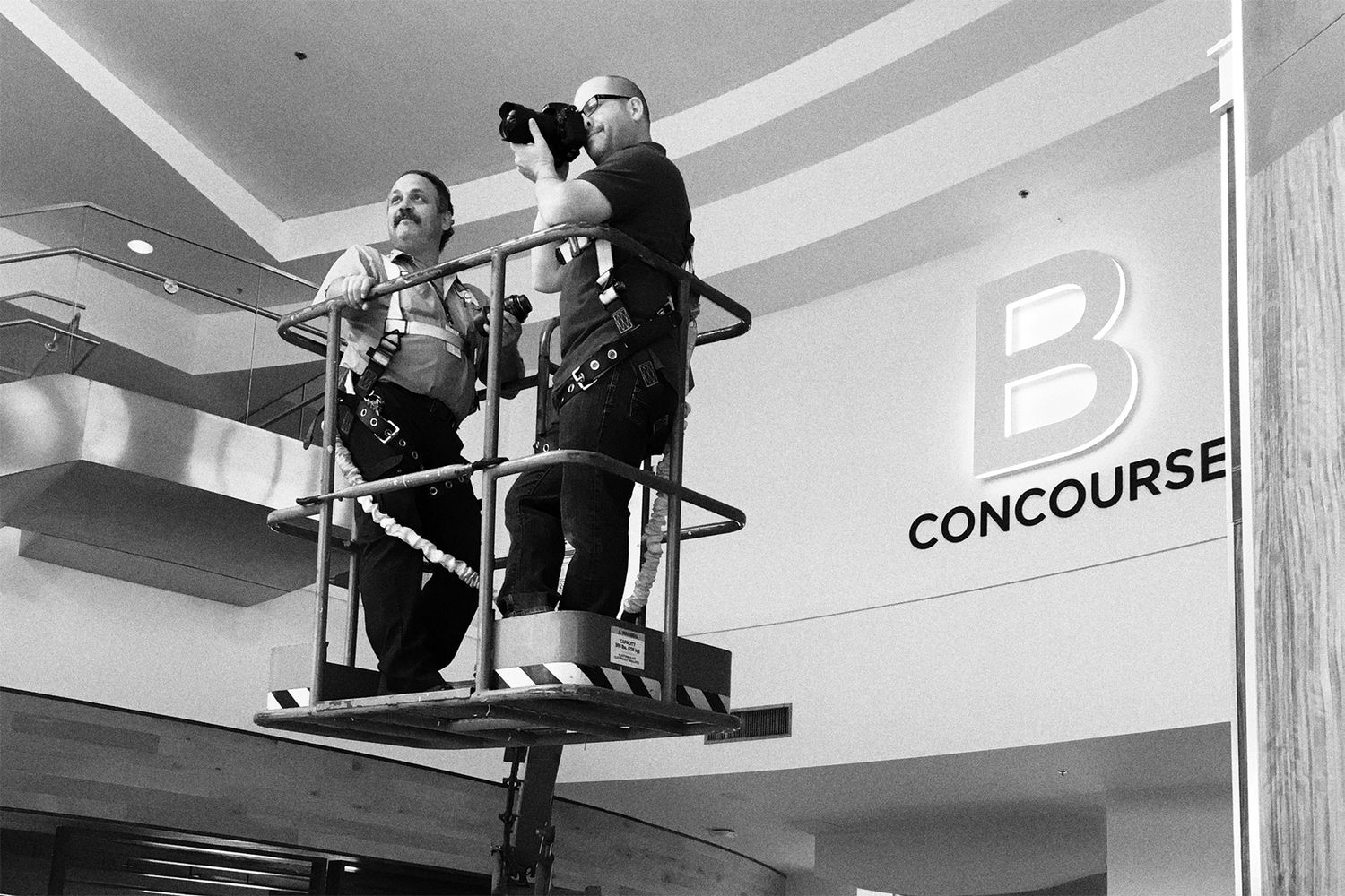 Photograph of John Magnoski on a scissor lift while photographing a concourse hub at the Louisville International Airport.