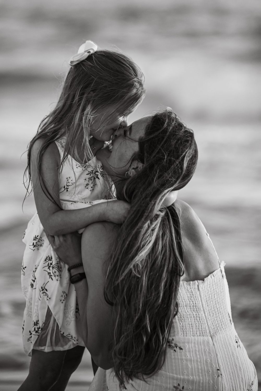 Mother and daughter posing ideas in Destin Florida. Family photography on the beach near me. Highly rated photographer that is affordable.