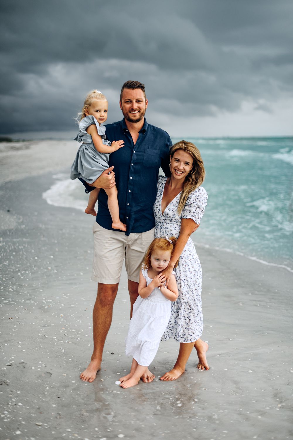 Destin Family Photographer captures the moody beach vibe while family of four enjoys the best beach on the emerald coast. MJphotograph FWB