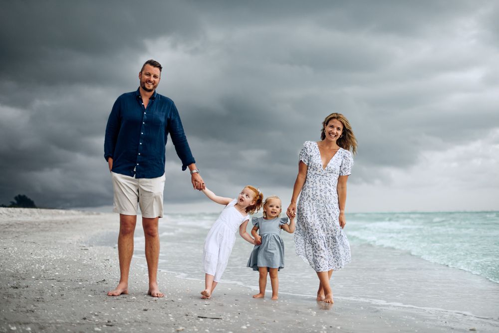 Destin Family Photographer captures the moody beach vibe while family of four enjoys the best beach on the emerald coast. MJphotograph FWB