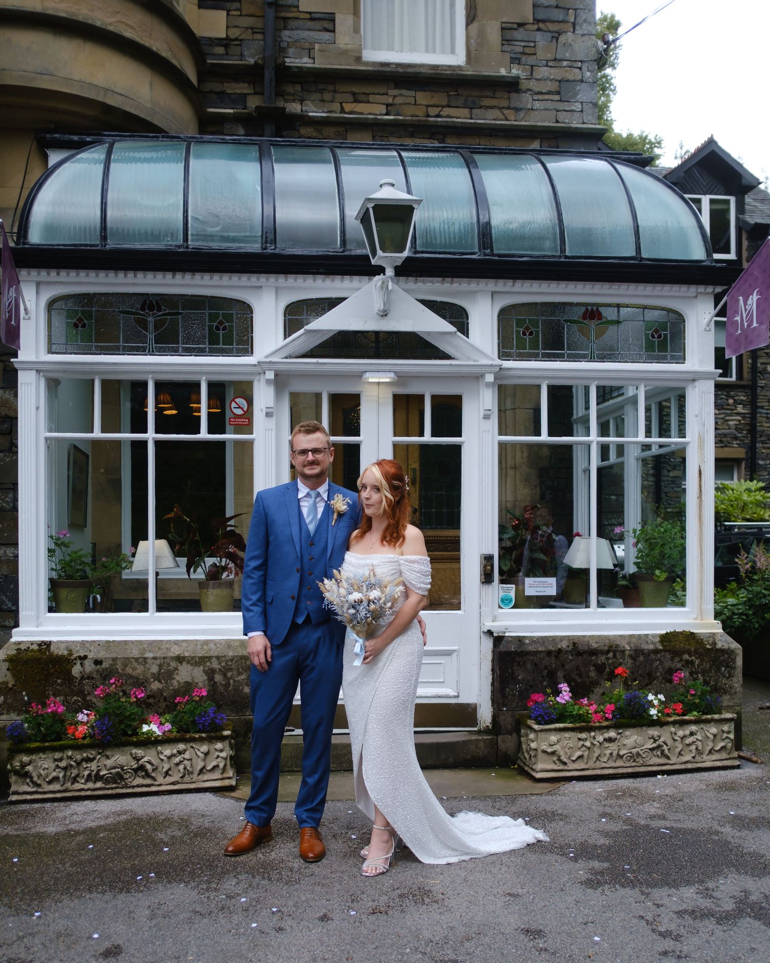 Bride and groom outside the entrance of Merewood Country House Hotel.